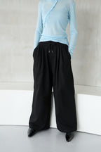 Tucked wide sweatpants