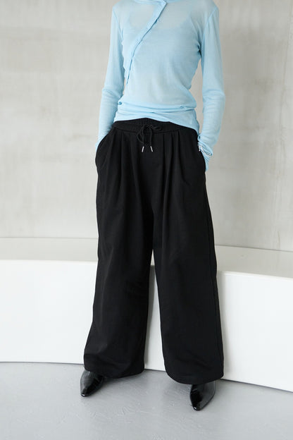 Tucked wide sweatpants