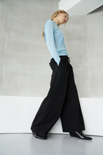 Tucked wide sweatpants